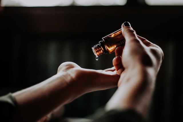 Image of Pouring Oil on Hand